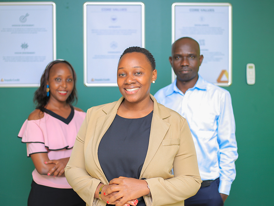 impala-credit-team-standing-infront-of-a-teal-wall